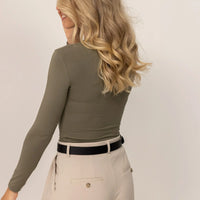 Woman wearing Marame Long Sleeve Fitted T-Shirt in Autumn Khaki, rear view.