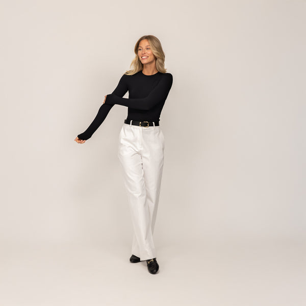 Woman wearing Marame Long Sleeve Fitted T-Shirt in Black, front view.