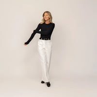 Woman wearing Marame Long Sleeve Fitted T-Shirt in Black, front view.|black