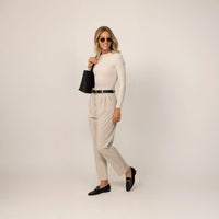 Woman wearing Marame Long Sleeve Fitted T-Shirt in Cosy Cream, front view.|cosy cream