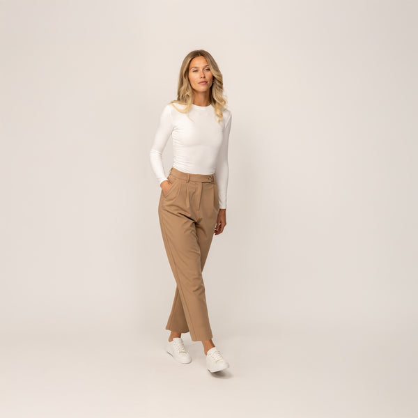 Woman wearing Marame Long Sleeve Fitted T-Shirt in White, front view.