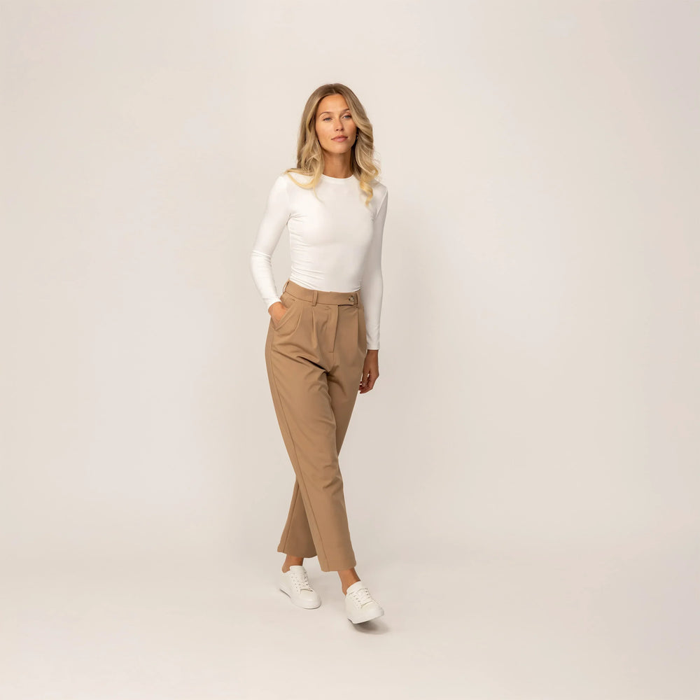 Woman wearing Marame Long Sleeve Fitted T-Shirt in White, front view.