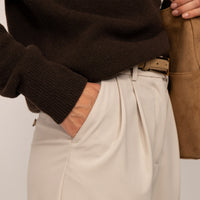 Woman wearing a Merino Wool Crew Neck Jumper in Rich Chocolate, closeup.