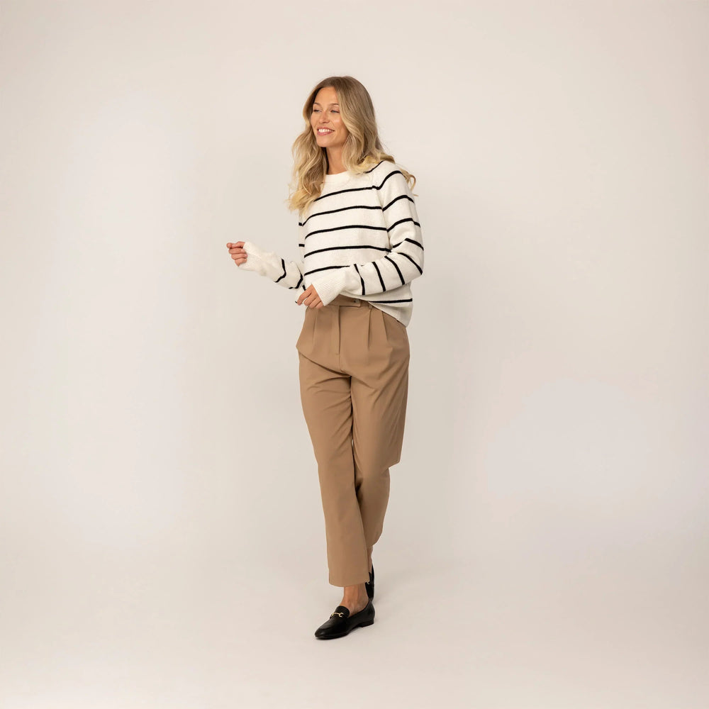 Woman wearing a Marame Merino Wool Crew Neck Jumper in Vanilla Cream/Black, full view.|Vanilla Cream/Black