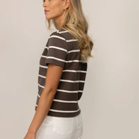 Woman wearing a Regular Fit Striped T-Shirt in Ash Sand/White Snow, rear view. |Ash Sand/White Snow