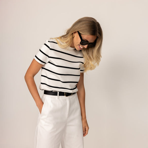 Woman wearing a Regular Fit Striped T-Shirt in White Snow/Black, front view.