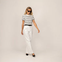 Woman wearing a Marame Regular Fit Striped T-Shirt in White Snow/Black, front view.