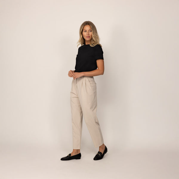 Woman wearing a Marame Regular Fit T-Shirt in Black, front view.