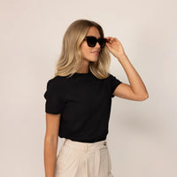 Woman wearing a Marame Regular Fit T-Shirt in Black, front view. |black