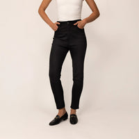Woman wearing Marame Slim Leg Jeans in Black Wash Denim, front view.