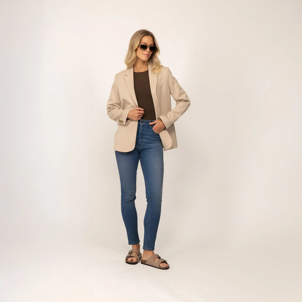 Woman wearing Marame Slim Leg Jeans in Deep Navy Wash Denim, full view. |deep navy wash denim