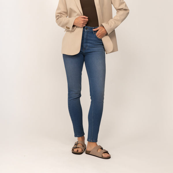 Woman wearing Marame Slim Leg Jeans in Deep Navy Wash Denim, front view.