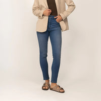 Woman wearing Marame Slim Leg Jeans in Deep Navy Wash Denim, front view. |deep navy wash denim