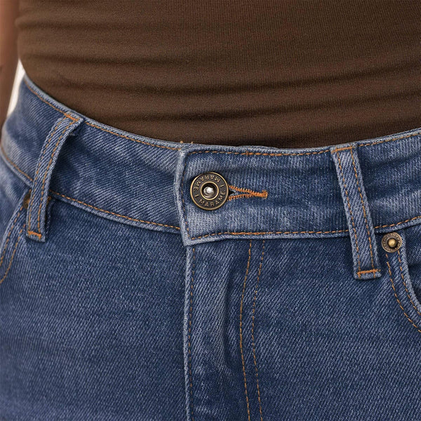 Woman wearing Marame Slim Leg Jeans in Deep Navy Wash Denim, detail. |deep navy wash denim