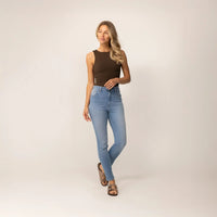 Woman wearing Marame Slim Leg Jeans in Light Wash Denim, full view. |light wash denim