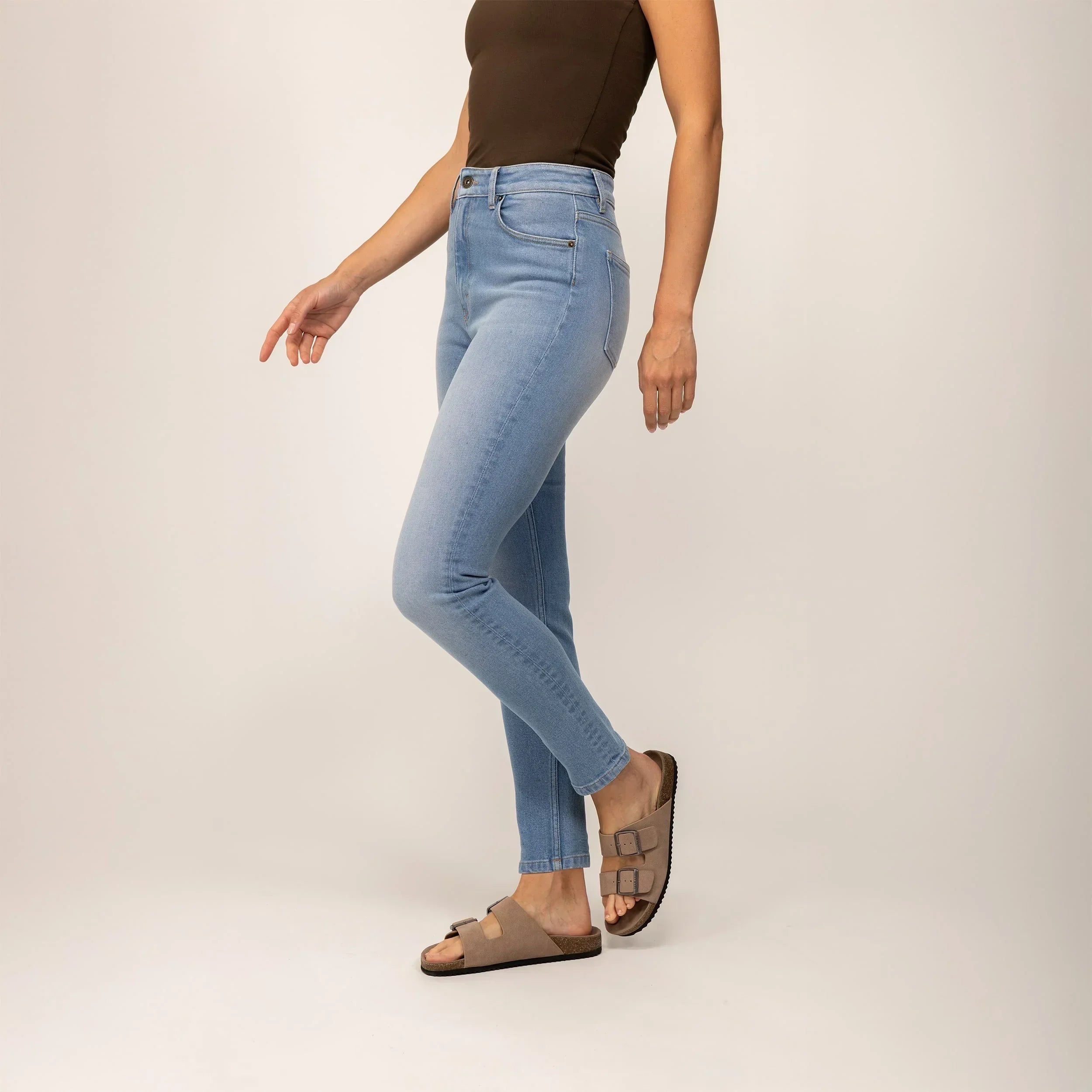 Woman wearing Marame Slim Leg Jeans in Light Wash Denim, front view. |light wash denim