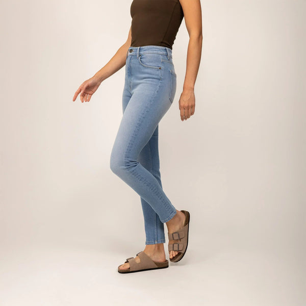 Woman wearing Marame Slim Leg Jeans in Light Wash Denim, front view. |light wash denim