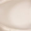 Woman wearing Marame Smart Leather Trainers in White, closeup.|white