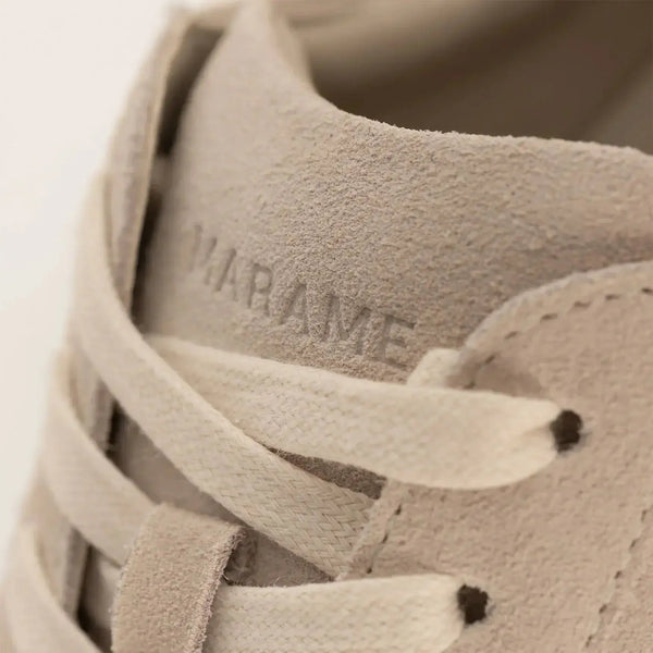 Woman wearing Marame Smart Suede Trainers in Grey, closeup.|grey