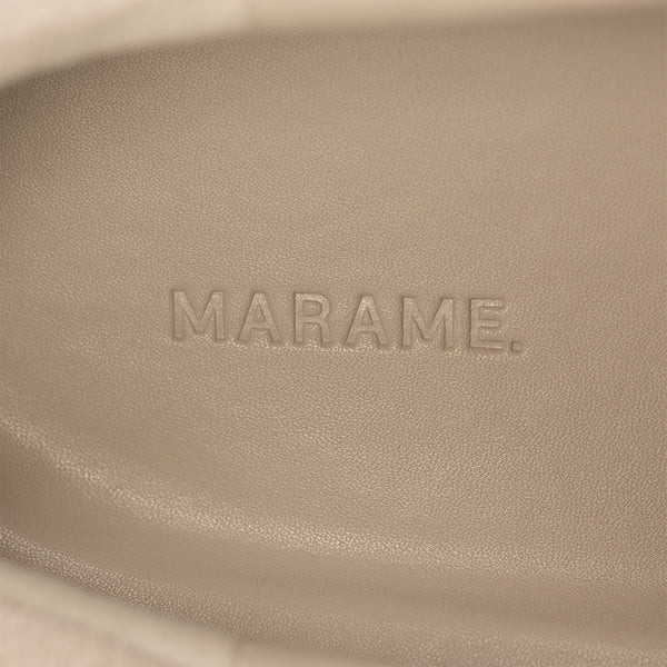 Woman wearing Marame Smart Suede Trainers in Grey, detail.