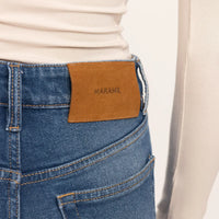 Woman wearing Straight Leg Jeans in Deep Navy Wash Denim, detail.