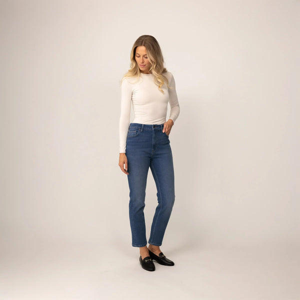 Woman wearing Marame Straight Leg Jeans in Deep Navy Wash Denim, front view. |deep navy wash denim