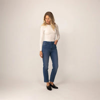 Woman wearing Marame Straight Leg Jeans in Deep Navy Wash Denim, front view. |deep navy wash denim