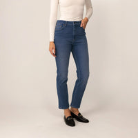 Woman wearing Marame Straight Leg Jeans in Deep Navy Wash Denim, front view.