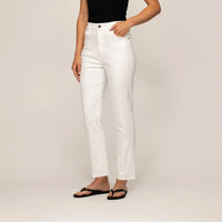 Woman wearing Marame Straight Leg Jeans in White Cotton Denim, front view.