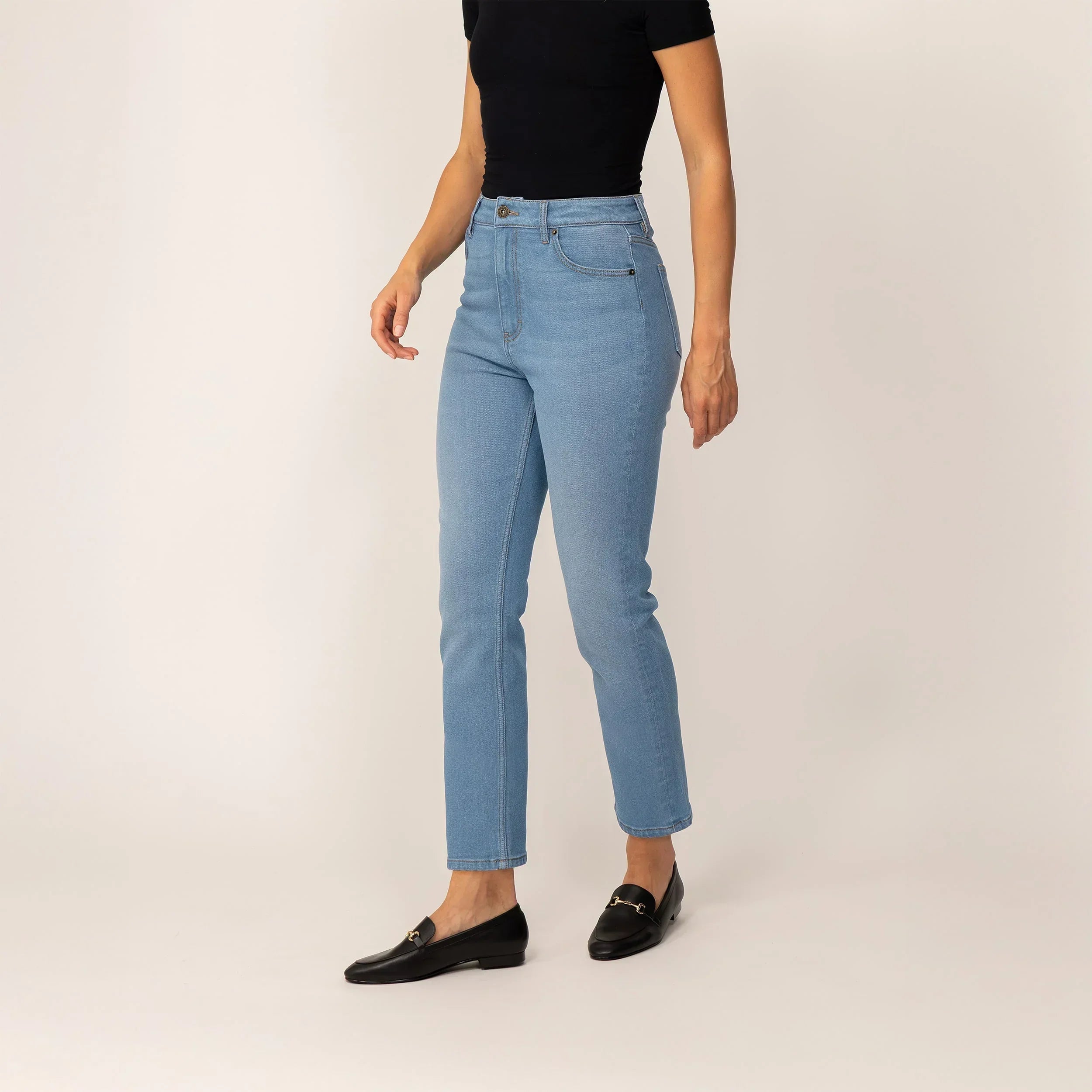 Woman wearing Marame Straight Leg Jeans in Light Wash Denim, front view. |light wash denim