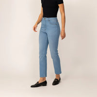 Woman wearing Marame Straight Leg Jeans in Light Wash Denim, front view.